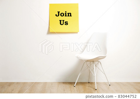 Head hunting help wanted poster concept. Minimalistic composition with chair and blank copy space wall. Head hunting help wanted poster concept. Minimalistic composition with chair and blank copy space wall. 83044752