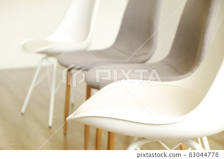 Empty chairs. Vacant job position concept. Minimlistic interior lofty room with elegant furniture pieces. Empty chairs. Vacant job position concept. Minimlistic interior lofty room with elegant furniture pieces. 83044778