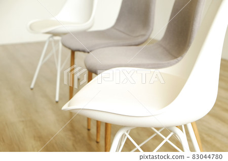 Empty chairs. Vacant job position concept. Minimlistic interior lofty room with elegant furniture pieces. Empty chairs. Vacant job position concept. Minimlistic interior lofty room with elegant furniture pieces. 83044780