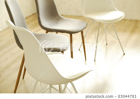 Empty chairs. Vacant job position concept. Minimlistic interior lofty room with elegant furniture pieces. Empty chairs. Vacant job position concept. Minimlistic interior lofty room with elegant furniture pieces. 83044781