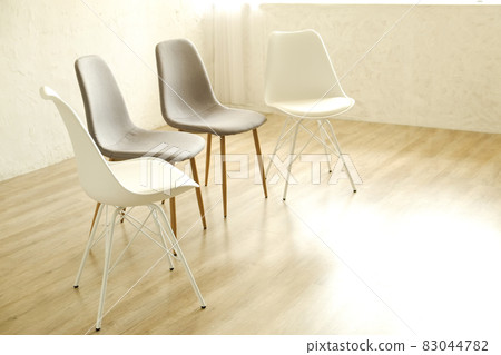 Empty chairs. Vacant job position concept. Minimlistic interior lofty room with elegant furniture pieces. Empty chairs. Vacant job position concept. Minimlistic interior lofty room with elegant furniture pieces. 83044782