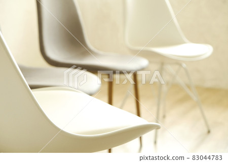 Empty chairs. Vacant job position concept. Minimlistic interior lofty room with elegant furniture pieces. Empty chairs. Vacant job position concept. Minimlistic interior lofty room with elegant furniture pieces. 83044783