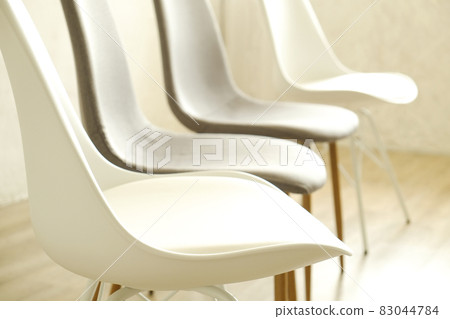 Empty chairs. Vacant job position concept. Minimlistic interior lofty room with elegant furniture pieces. Empty chairs. Vacant job position concept. Minimlistic interior lofty room with elegant furniture pieces. 83044784