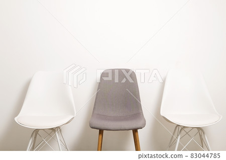 Empty chairs. Vacant job position concept. Minimlistic interior lofty room with elegant furniture pieces. Empty chairs. Vacant job position concept. Minimlistic interior lofty room with elegant furniture pieces. 83044785