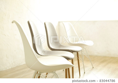 Empty chairs. Vacant job position concept. Minimlistic interior lofty room with elegant furniture pieces. Empty chairs. Vacant job position concept. Minimlistic interior lofty room with elegant furniture pieces. 83044786