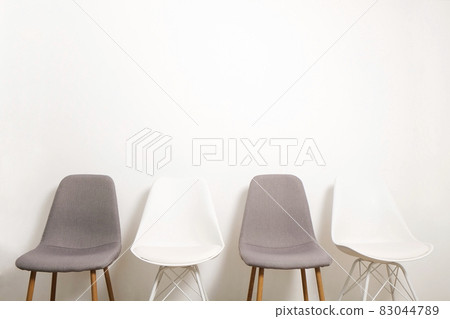 Empty chairs. Vacant job position concept. Minimlistic interior lofty room with elegant furniture pieces. Empty chairs. Vacant job position concept. Minimlistic interior lofty room with elegant furniture pieces. 83044789