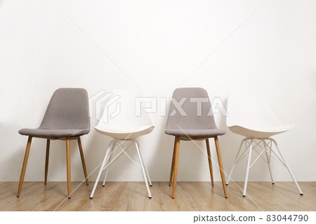 Empty chairs. Vacant job position concept. Minimlistic interior lofty room with elegant furniture pieces. Empty chairs. Vacant job position concept. Minimlistic interior lofty room with elegant furniture pieces. 83044790