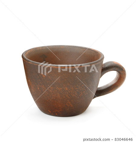 Handmade clay cup isolated on white. 83046646