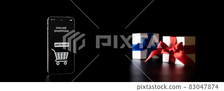 Black friday sale. Internet online shopping app on mobile phone, white gift box with red ribbon isolated on black background in Black Friday concept. Sale banner. Black friday sale. Internet online shopping app on mobile phone, white gift box with red ribbon isolated on black background in Black Friday concept. Sale banner. 83047874