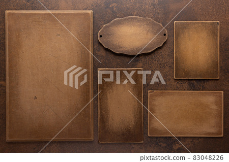 Wooden nameplate or sign board at wall background. Front view of name plate Wooden nameplate or sign board at wall background. Front view of name plate 83048226