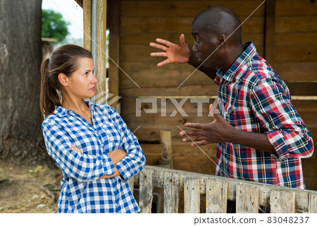 Angry woman quarreling with neighbor 83048237