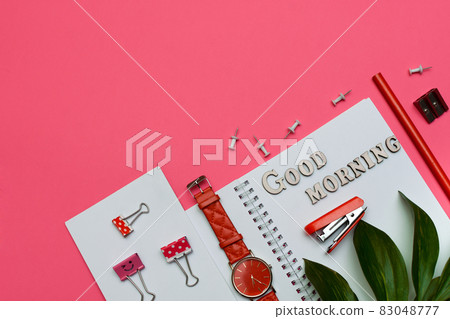 layout with good morning on a pink background. business working Flat lay. notepad, watch, stapler. copy space layout with good morning on a pink background. business working Flat lay. notepad, watch, stapler. copy space 83048777
