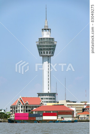 The observation tower on Samut Prakan coast with boat traffic on Chao Phraya river. The observation tower on Samut Prakan coast with boat traffic on Chao Phraya river. 83049275