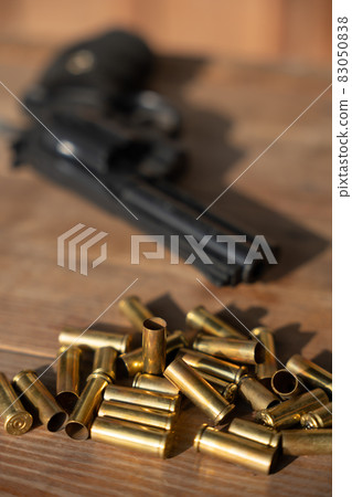 Image of pistol and empty cartridge case 83050838