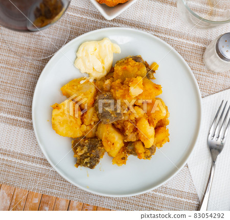 Homemade stewed veal with potato and carrot Homemade stewed veal with potato and carrot 83054292