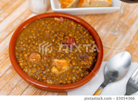 Stewed lentils with sausages, spanish Riojan lentils 83054366