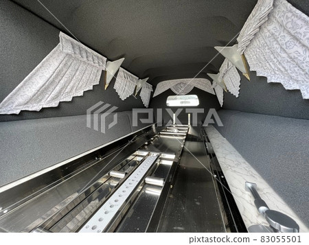 A photo of the inside of a hearse 83055501
