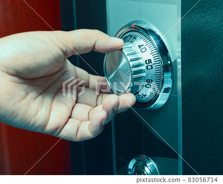 hand turning code number on safe box 83056714