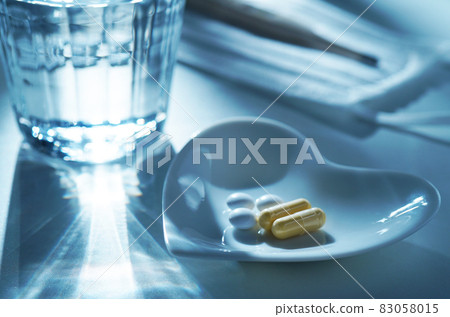 Medicine, mask, thermometer and mineral water Medicine, mask, thermometer and mineral water 83058015