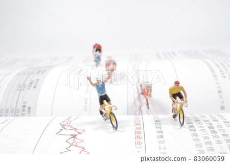 the Mini people, Small figures cycling on open book 83060059