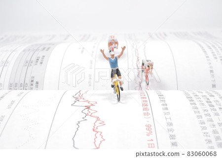 the Mini people, Small figures cycling on open book 83060068