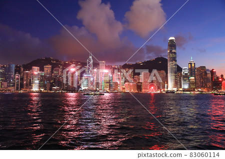 the Victoria Harbour , central at twilight, after sunset. 22 May 2021 83060114