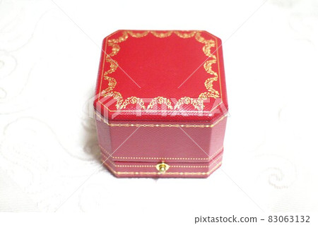 Red present box with a ring Red present box with a ring 83063132