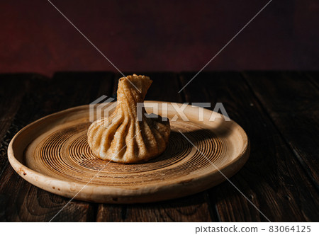fried khinkali on a plate. Georgian cuisine 83064125