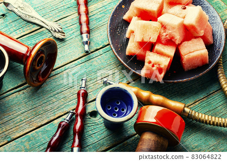 Tobacco shisha for smoking with watermelon Tobacco shisha for smoking with watermelon 83064822