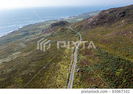 Aerial view of the coastal single track road between Meenacross and Crohy Head south of Dungloe, County Donegal - Ireland Aerial view of the coastal single track road between Meenacross and Crohy Head south of Dungloe, County Donegal - Ireland 83067102