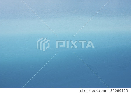 Background azure blue expanse of the sea with small ripples on the water. Transition from light blue to dark blue Background azure blue expanse of the sea with small ripples on the water. Transition from light blue to dark blue 83069103