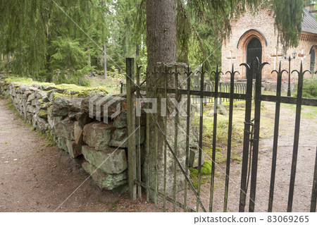 Black fence at old chapel at Wrede family cemetery. 4 September 2018 - Anjala, Kouvola, Finland. Black fence at old chapel at Wrede family cemetery. 4 September 2018 - Anjala, Kouvola, Finland. 83069265