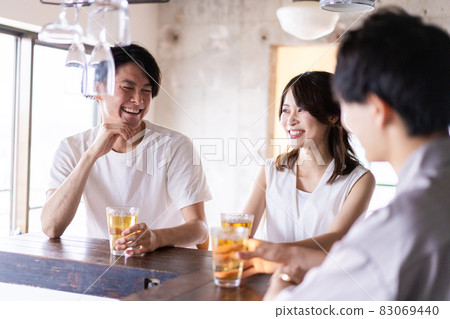 Young people drinking at the bar 83069440