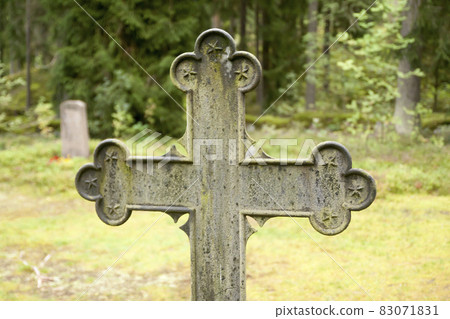 Cross at old beautiful semetery in Finland. 83071831
