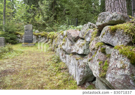 Old semetery in Finland with grave crosses and stones. 83071837