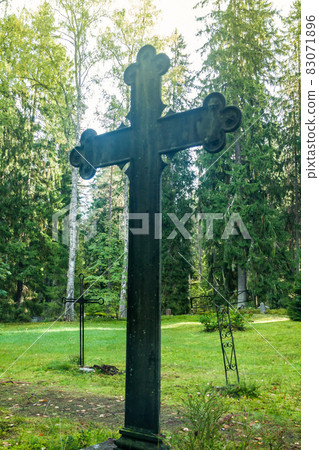 Cross at old beautiful semetery in Finland. Cross at old beautiful semetery in Finland. 83071896