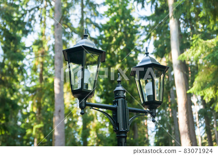 Old black lantern at forest in Finland. Old black lantern at forest in Finland. 83071924