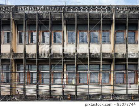 Row of aged commercial building with window in suburban Row of aged commercial building with window in suburban 83072744
