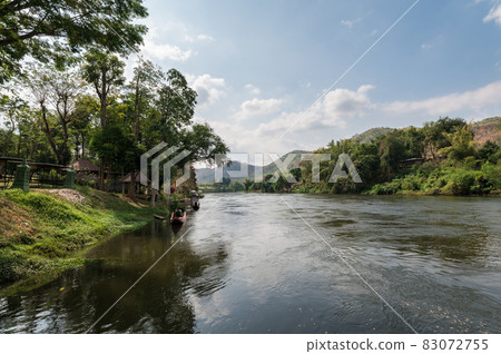 Scenery of mountain and water flowing on riverside at River Kwai 83072755