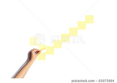 checkmark made with empty sticky notes with a hand holding one of them checkmark made with empty sticky notes with a hand holding one of them 83073984