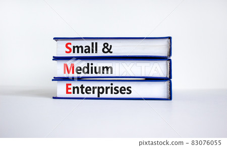 SME small and medium enterprises symbol. Words SME small and medium enterprises on books on a beautiful white table, white background. Business, SME small and medium enterprises concept. Copy space. 83076055