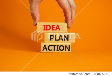 Idea, plan, action symbol. Wooden blocks form the words 'Idea, plan, action' on beautiful orange background. Businessman hand. Business, idea, plan, action concept. Copy space. Idea, plan, action symbol. Wooden blocks form the words 'Idea, plan, action' on beautiful orange background. Businessman hand. Business, idea, plan, action concept. Copy space. 83076059