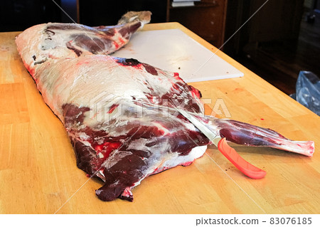 A side of wild deer meat ready to be cut up 83076185