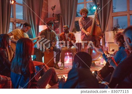 People playing in musical band 83077115