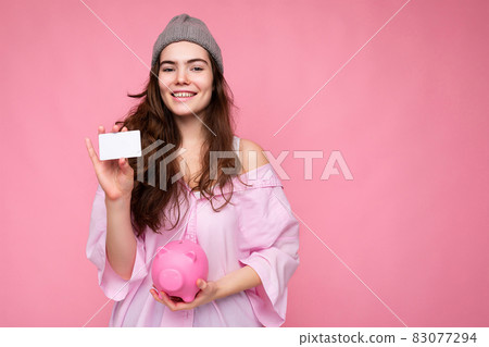 Portrait of beautiful positive cheerful cute smiling young brunette woman in stylish shirt isolated Portrait of beautiful positive cheerful cute smiling young brunette woman in stylish shirt isolated 83077294