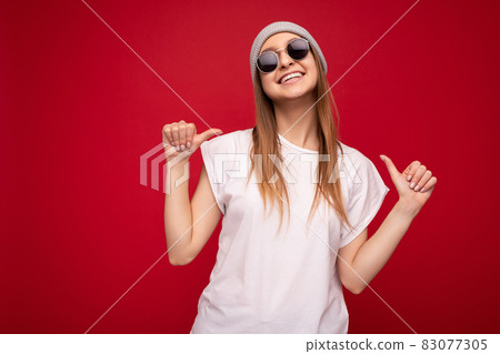 Photo of cute nice winsome positive adult woman wearing casual outfit isolated on background wall Photo of cute nice winsome positive adult woman wearing casual outfit isolated on background wall 83077305