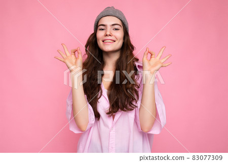 Portrait of beautiful positive cheerful cute smiling young brunette woman in stylish shirt and Portrait of beautiful positive cheerful cute smiling young brunette woman in stylish shirt and 83077309