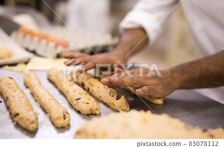 Closeup shot of making sweet buns with dough 83078112