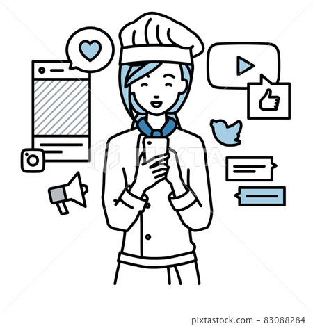 一個女廚師站起來，在她的智能手機上的各種SNS上愉快地互動 83088284
