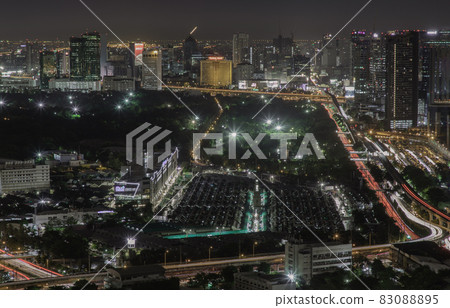 Aerial view of Bang Sue central station with skyscrapers background at night. Aerial view of Bang Sue central station with skyscrapers background at night. 83088895